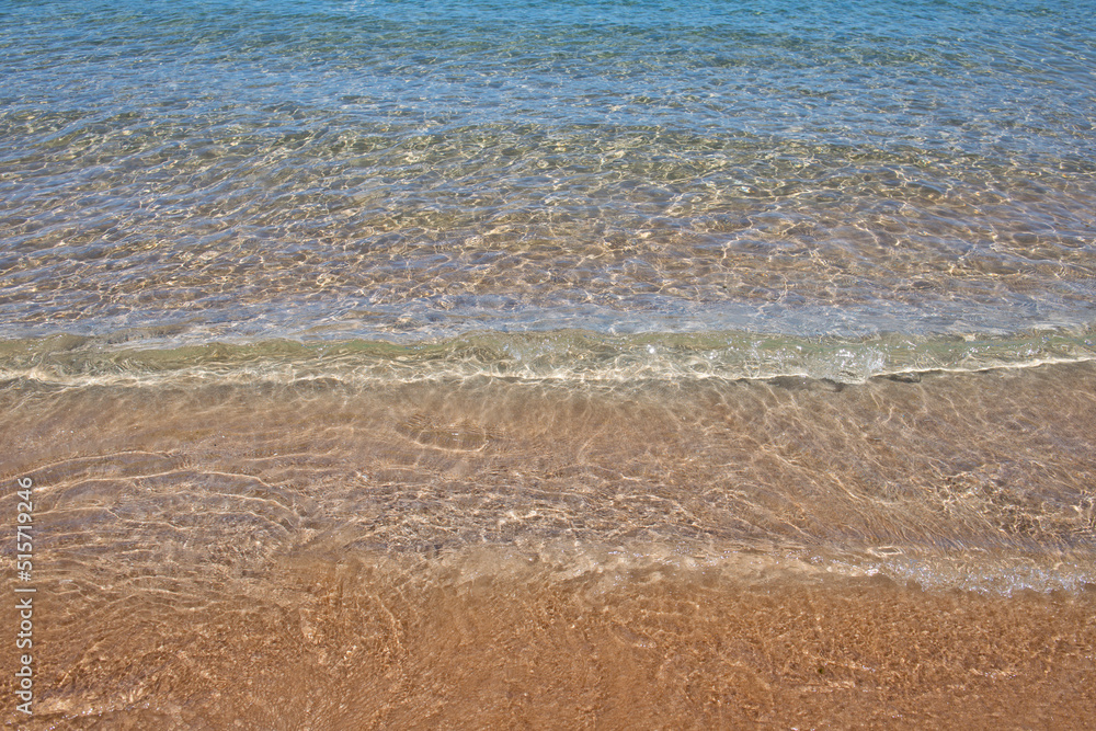 Sea background, nature of tropical summer beach with rays of sun light. Sand beach, sea water with copy space, summer vacation concept. Sea background, nature of tropical summer beach with rays of sun light. Sand beach, sea water with copy space, summer vacation concept.