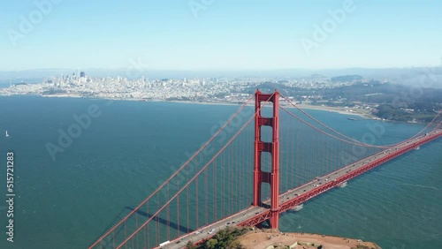 Aerial rotating shot of Golden Gate Bridge and San Francisco skyline, Bay Area