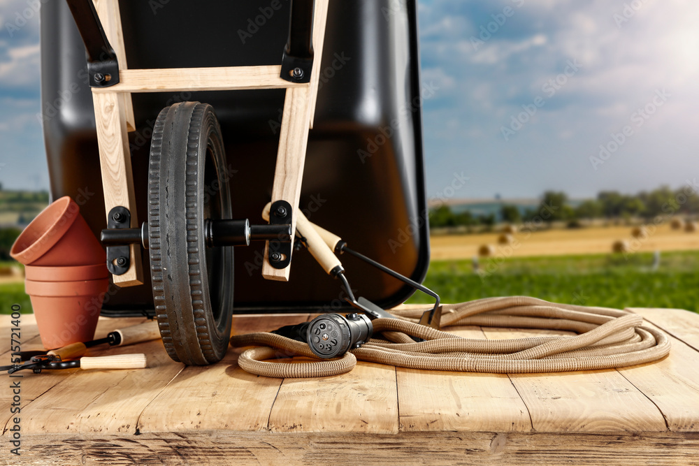 Naklejka premium Workin time and wheelbarrow 