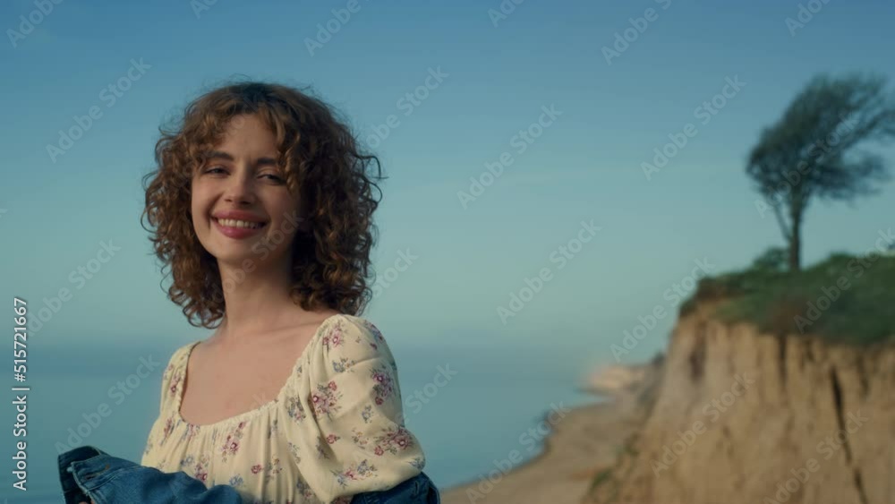 Portrait happy lady smiling on beautiful beach. Attractive girl looking camera.