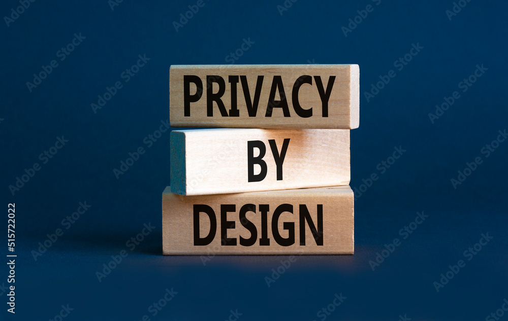 Privacy by design symbol. Concept words Privacy by design on wooden blocks on a beautiful grey table grey background. Business, finacial and privacy by design concept. Copy space.