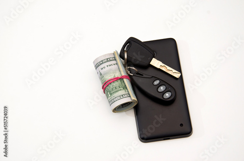 Roll of money, phone and car keys