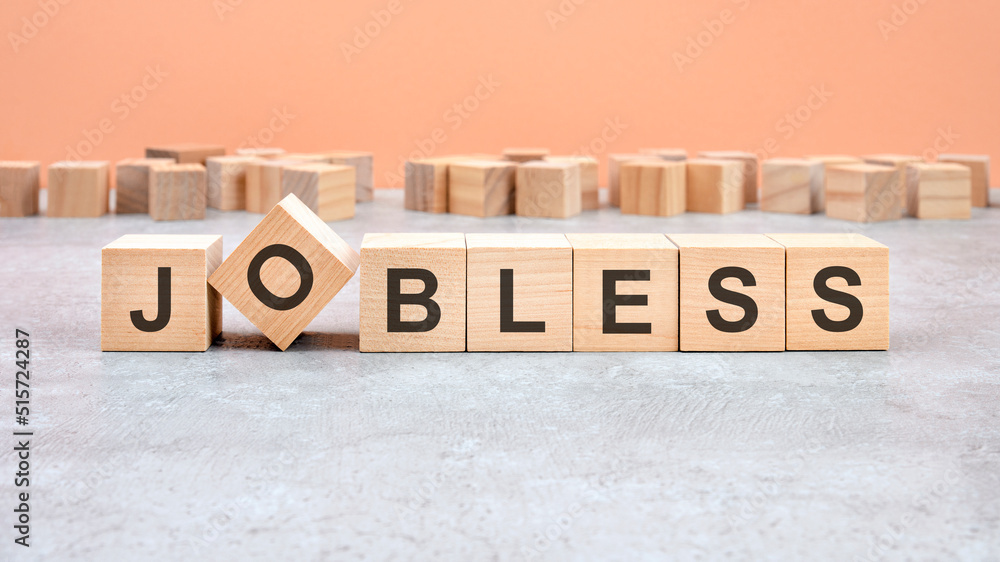 JOBLESS word written on wood block. Content text on wooden table for your desing, concept. JOBLESS word written on wood block. Content text on wooden table for your desing, concept.
