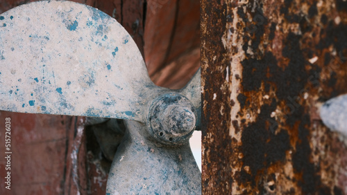 Big rusty propeller screw with rusty centerboard
