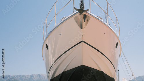 Fotografia Prow of docked for repair white yacht