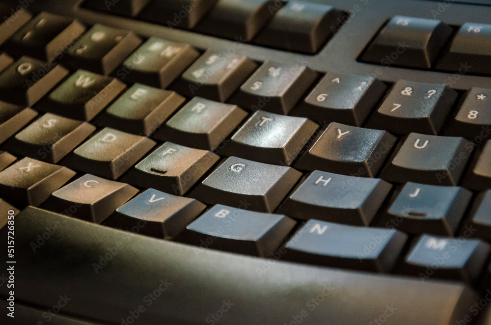 Black ergonomic computer keyboard. Closeup