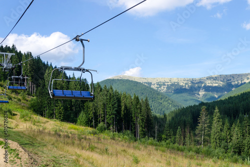 Green mountains, blue sky and mountain lift