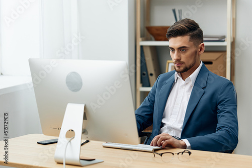 handsome businessman computer desktop work self-confidence workplace