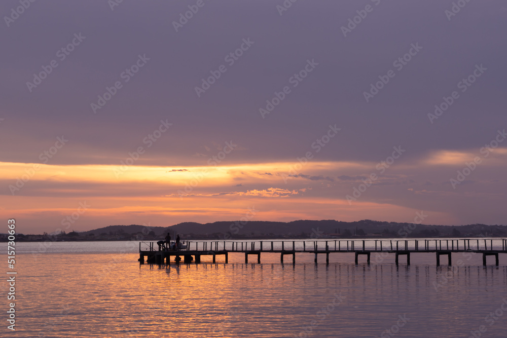 dock on the sea in the blue hour with violet sky