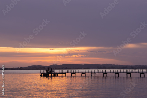 dock on the sea in the blue hour with violet sky © MATIAS