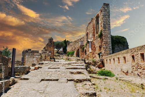 Ruined fortified walls of Xativa castle of Spain during sunset photo