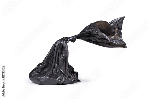 Black plastic dog poop bag on white background photo