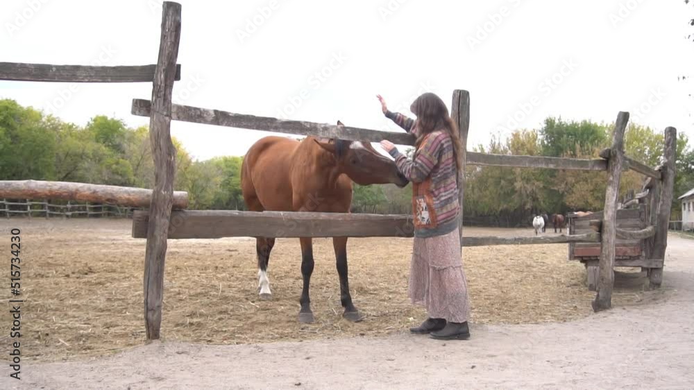 Slow Motion Female with horse outdoors at the farm at daytime. Slow Motion Female with horse outdoors at the farm at daytime.