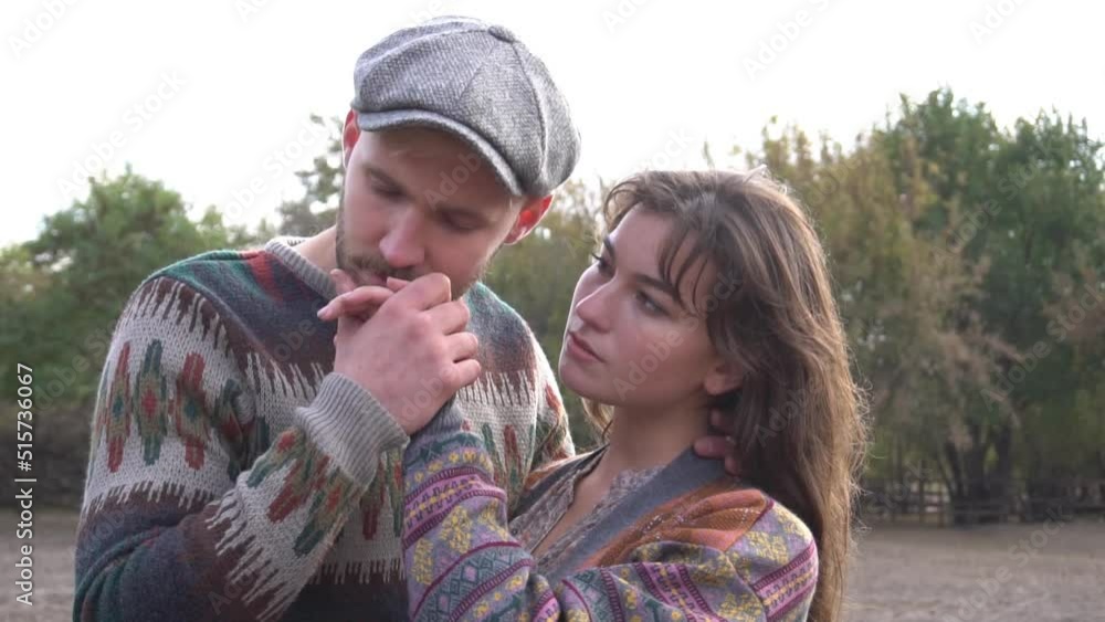 Stunning sensual portrait of young stylish fashion couple posing in summer Stunning sensual portrait of young stylish fashion couple posing in summer