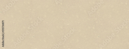 Kraft paper texture. Subtle irregular stains and fibers in beige tones. Panoramic background. Abstract pattern.