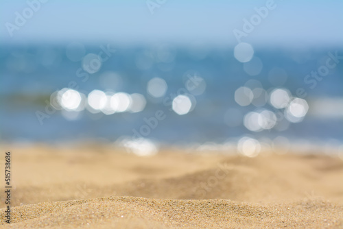 Sandy beach near sea on sunny day, closeup view