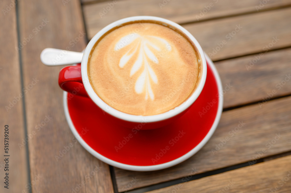 Cup of aromatic coffee on wooden table, above view Cup of aromatic coffee on wooden table, above view