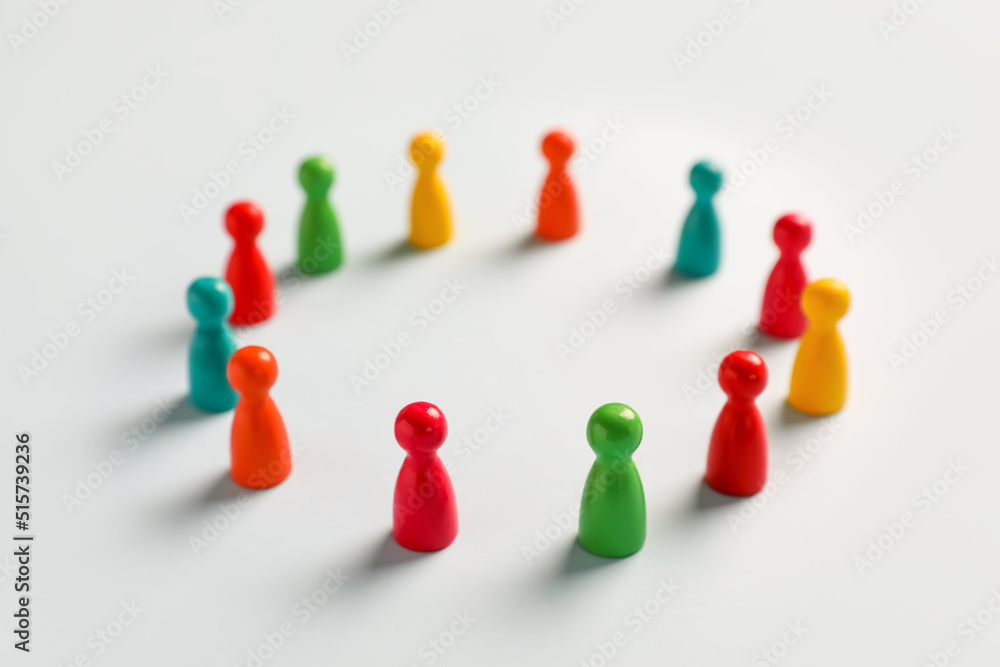 Colorful pawns on white background. Social inclusion concept Colorful pawns on white background. Social inclusion concept
