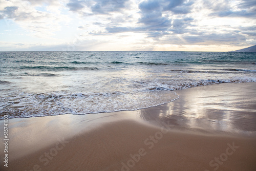 Summer vacation at a tropical beach. Paradise beach with sand and clear water of the sea. Ocean beach background.