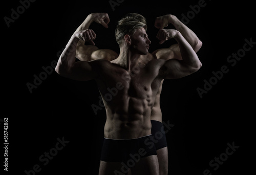 Two sexy man naked body, bare torso of group sexy man. Strong muscular man with perfect athletic body over black background.