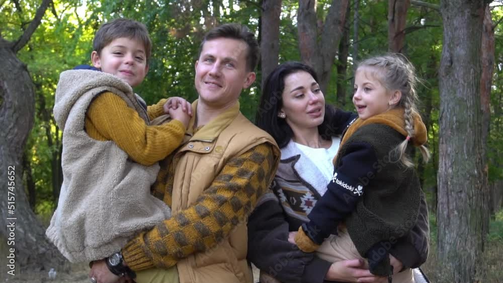 Young family with children in autumn park Young family with children in autumn park