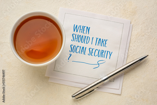 When should I take social security? Retirement and finance planning question, handwriting on napkin with tea.