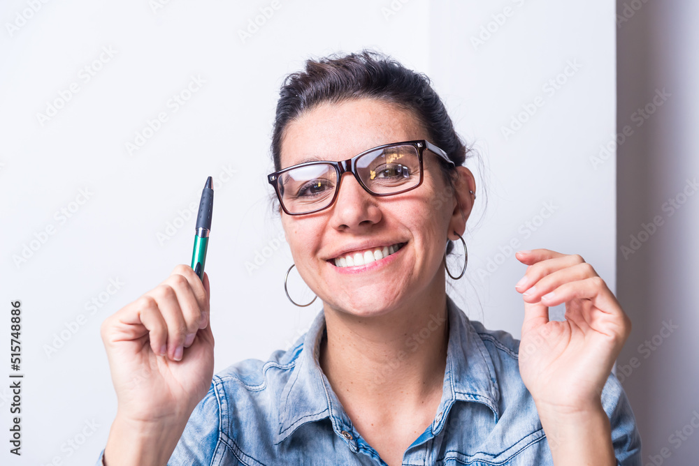 latina woman, studying at home, seated, close up, smiling, and pointing, college concept latina woman, studying at home, seated, close up, smiling, and pointing, college concept