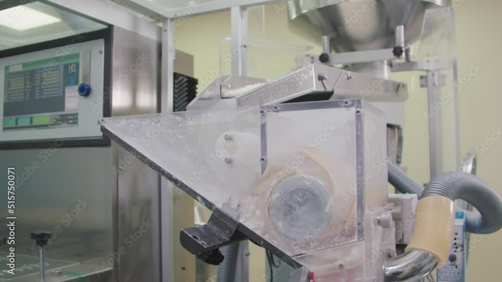 Batches of pills are falling down to automated sorting machine. drug production at pharmaceutical factory. chemical industry concept. Batches of pills are falling down to automated sorting machine. drug production at pharmaceutical factory. chemical industry concept.