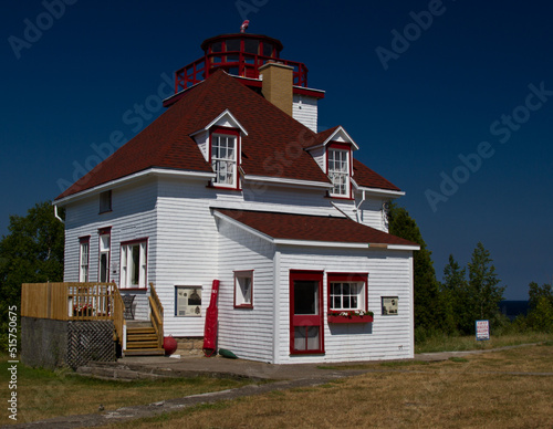 large lighthouse with blue sky