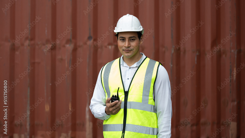 Worker, employee, or officer using radio at the job, American worker, Asian worker Worker, employee, or officer using radio at the job, American worker, Asian worker