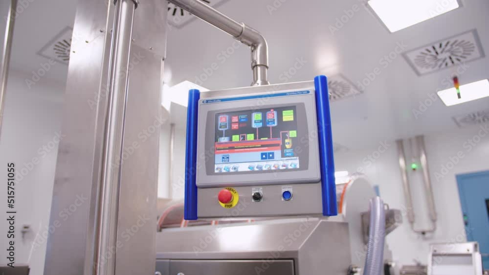Pharmaceutical automated machinery. industrial production line in a modern factory. computer operating display on medical equipment. Pharmaceutical automated machinery. industrial production line in a modern factory. computer operating display on medical equipment.