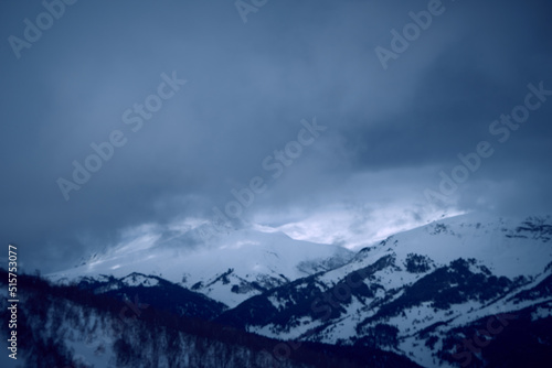 Image of a mountain covered with a snow cloud.