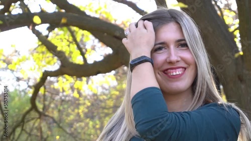 Portrait of beautiful young woman outdoors in autumn