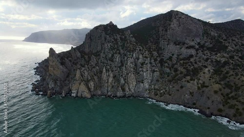 Fascinating view of the village of Novy Svet, Mount Kabakaya, Cape Kapchik, the Golitsyn hiking trail and Chaliapin's grotto. Aerial view from a drone in 4k. Tourist attractions of Crimea photo