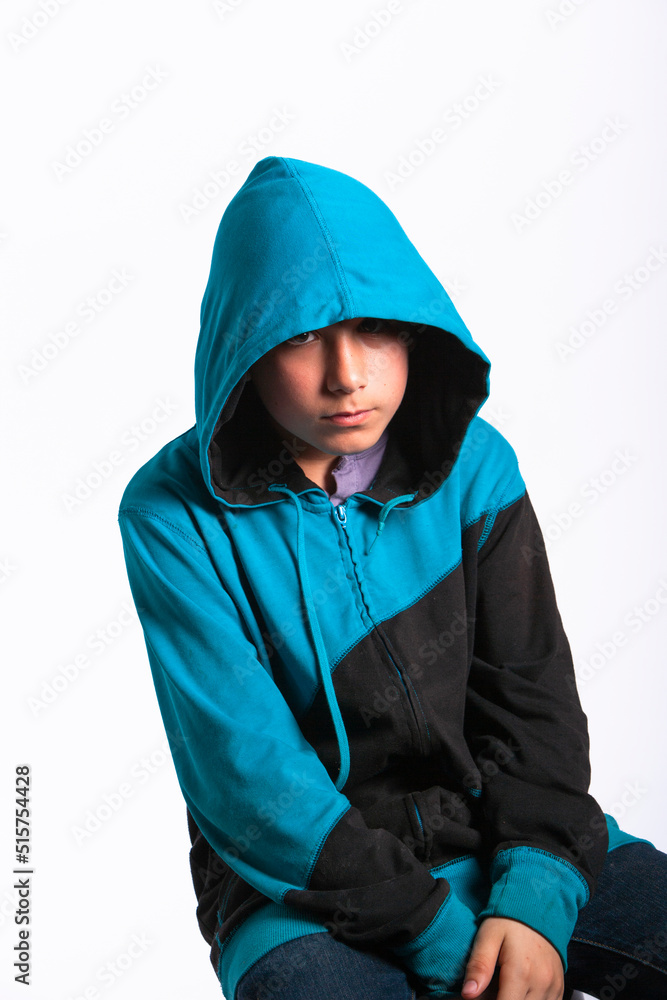 Young boy with a hooded sweatshirt in a studio Young boy with a hooded sweatshirt in a studio