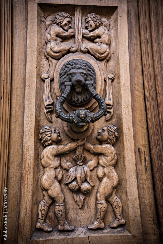 Old wooden door texture with lock and knob. Door of ancient building in Toledo, Spain
