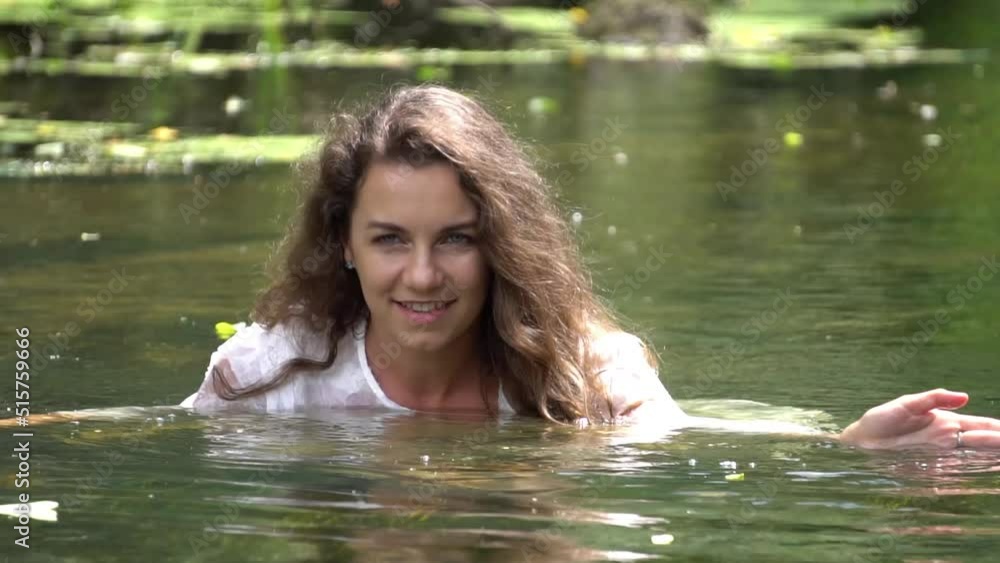 Slow Motion Beautiful young girl resting in water Slow Motion Beautiful young girl resting in water