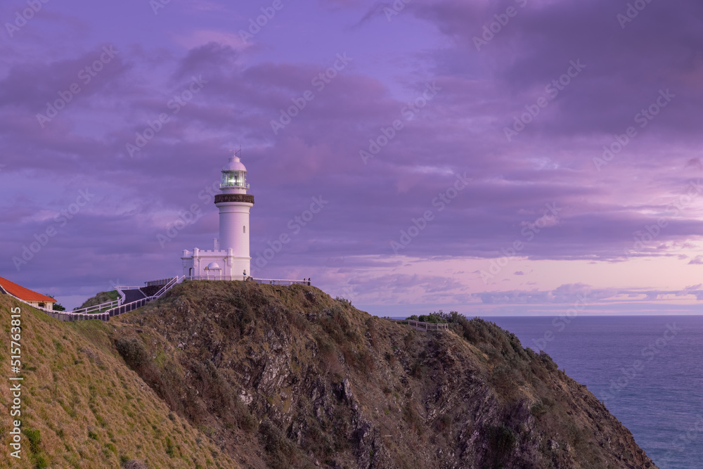 Naklejka premium a wide angle view of the historic lighthouse at sunrise on a spring morning at byron bay