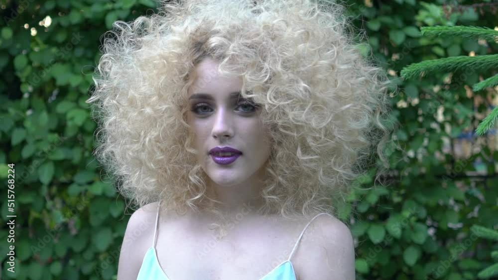 Slow Motion Portrait of lovely young woman with Afro hairstyle Slow Motion Portrait of lovely young woman with Afro hairstyle