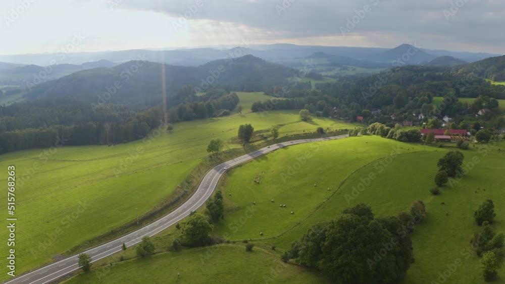 Cars driving on new countryside highway leading to czech village. Cars driving on new countryside highway leading to czech village.
