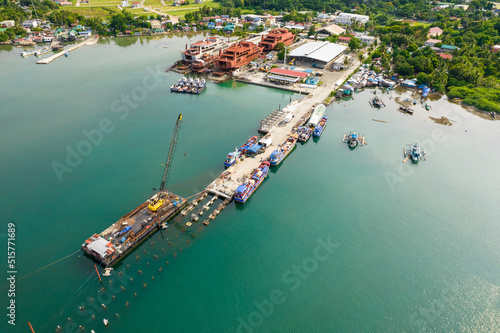 Sual, Pangasinan, Philippines - A fishing seaport under construction at the town of Sual. Josefa Slipways, and shipbuilding facility seen nearby. photo