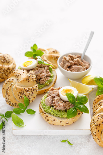 Canned tuna open sandwiches. Buns burgers with canned tuna, boiled egg and avocado