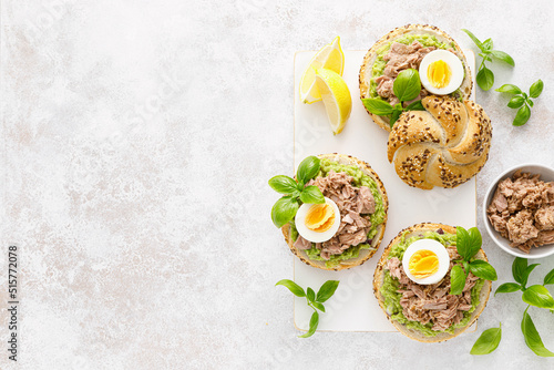 Canned tuna open sandwiches. Buns burgers with canned tuna, boiled egg and avocado