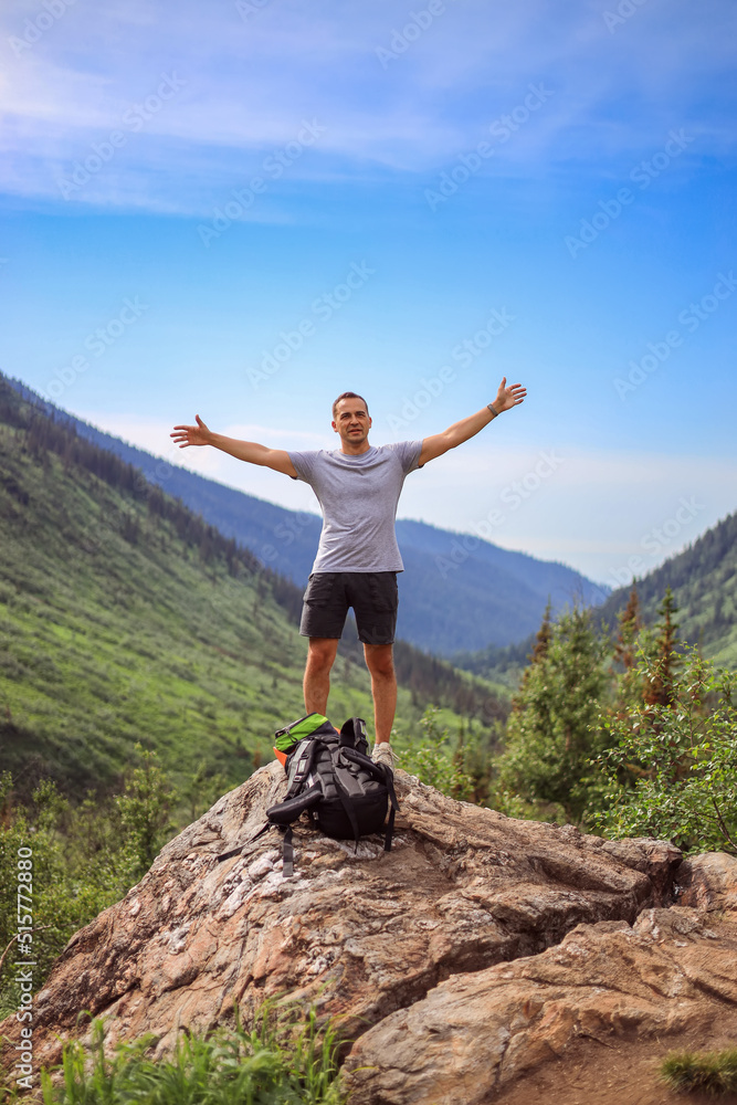 The traveler explores the mountains. Travel healthy lifestyle adventure trip hiking alone with a backpack outdoor activities The traveler explores the mountains. Travel healthy lifestyle adventure trip hiking alone with a backpack outdoor activities