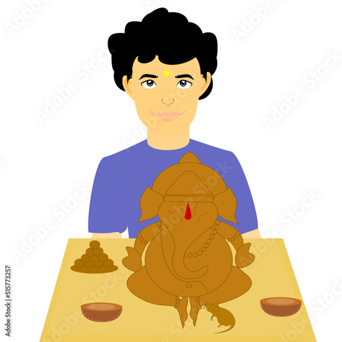 Indian Young boy holding handmade ecofriendly small GaneshGanpati idol or murti, Home made, preparing for Vinayaka Chavithi.