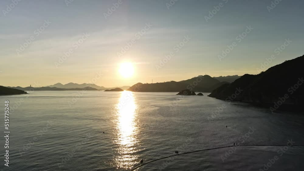 Drone flying towards the sun, Aerial Evening View Over the Sea Drone flying towards the sun, Aerial Evening View Over the Sea