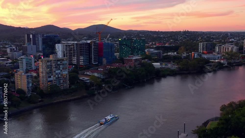 Aerial Panorama Of Modern Buildings With Sailing Ferry Boat At Toowong Riverside In The City of Brisbane, Queensland, Australia. photo