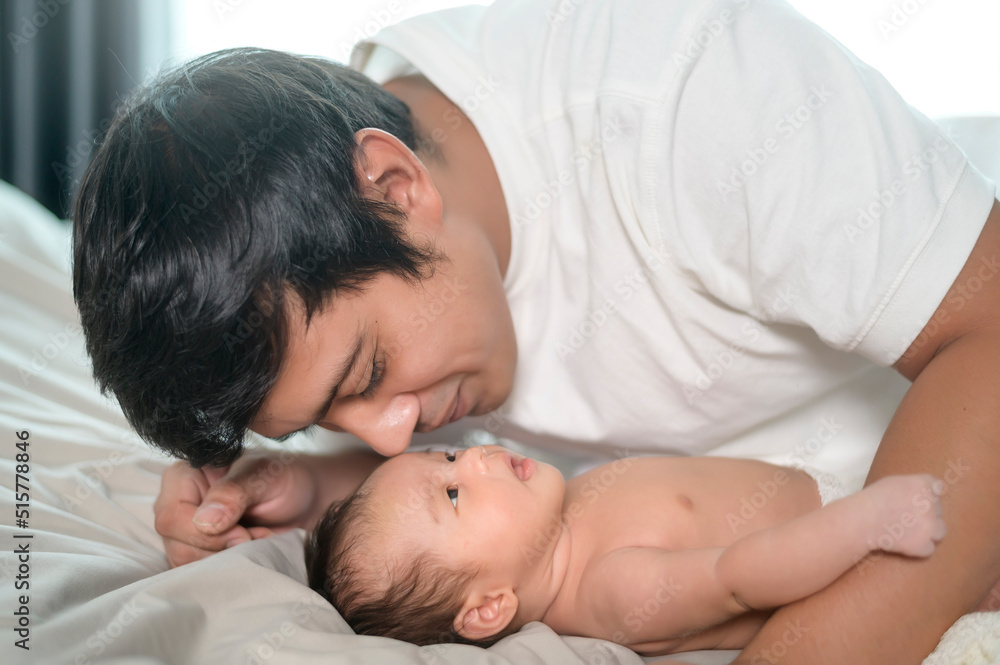 Young father with a Cute new born baby. Young father with a Cute new born baby.