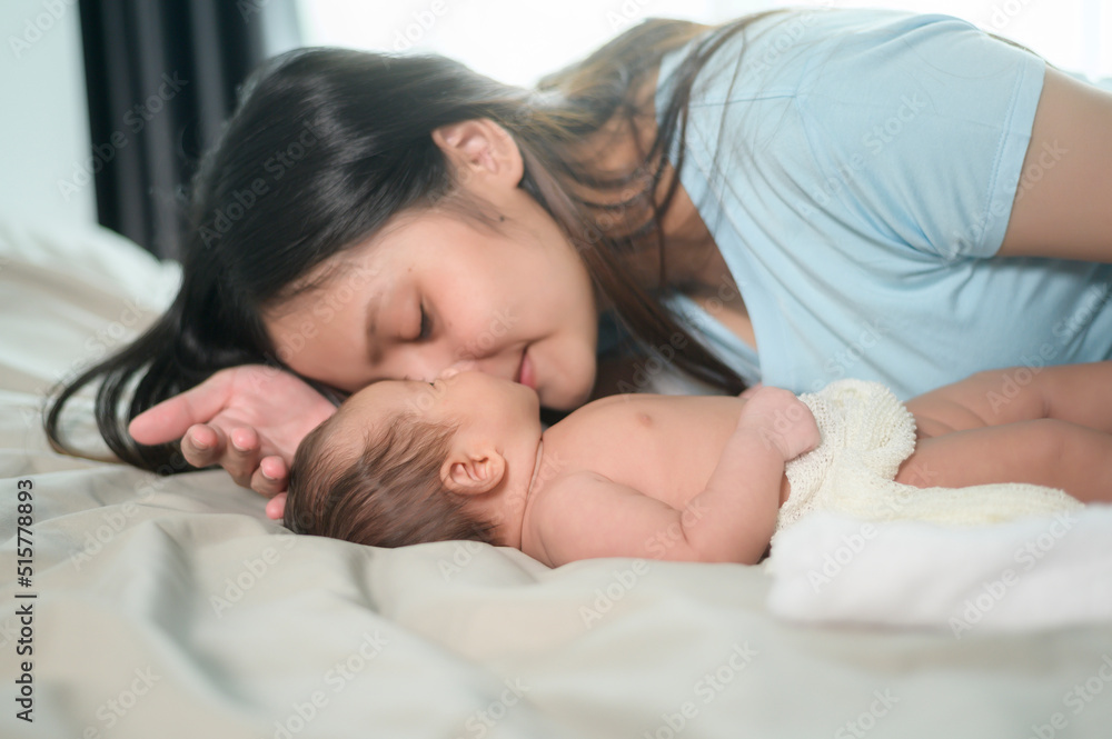 Young mother with a Cute new born baby. Young mother with a Cute new born baby.