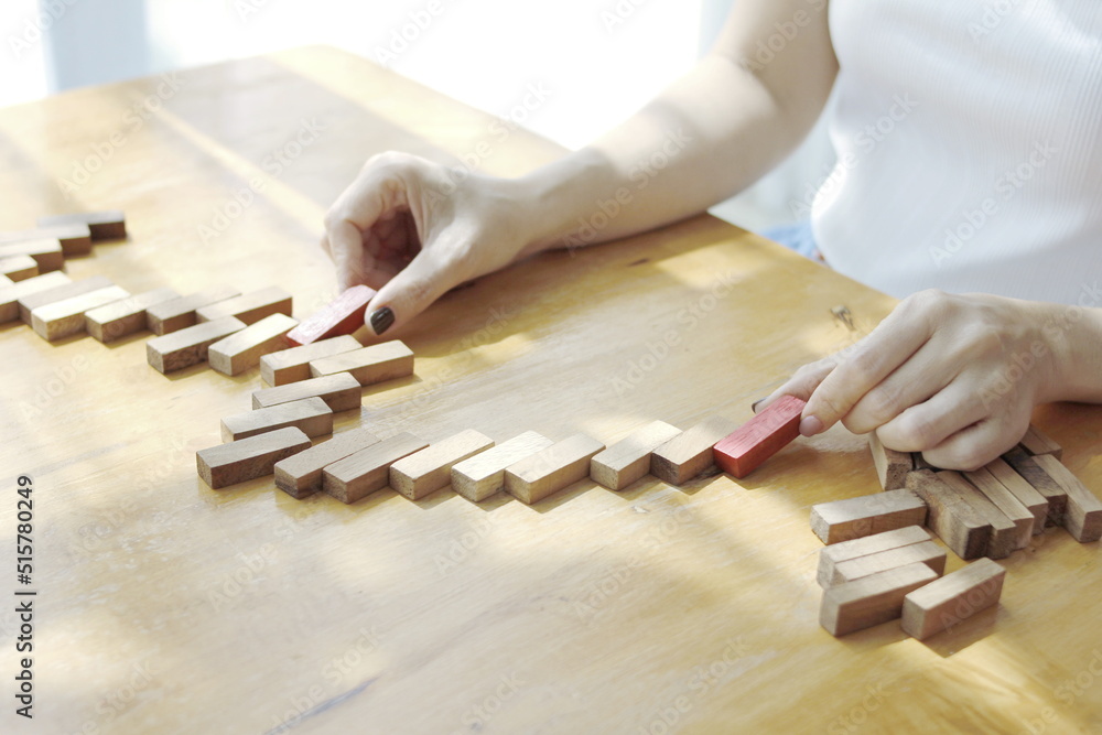 wooden blocks on table with female hands wood block connection